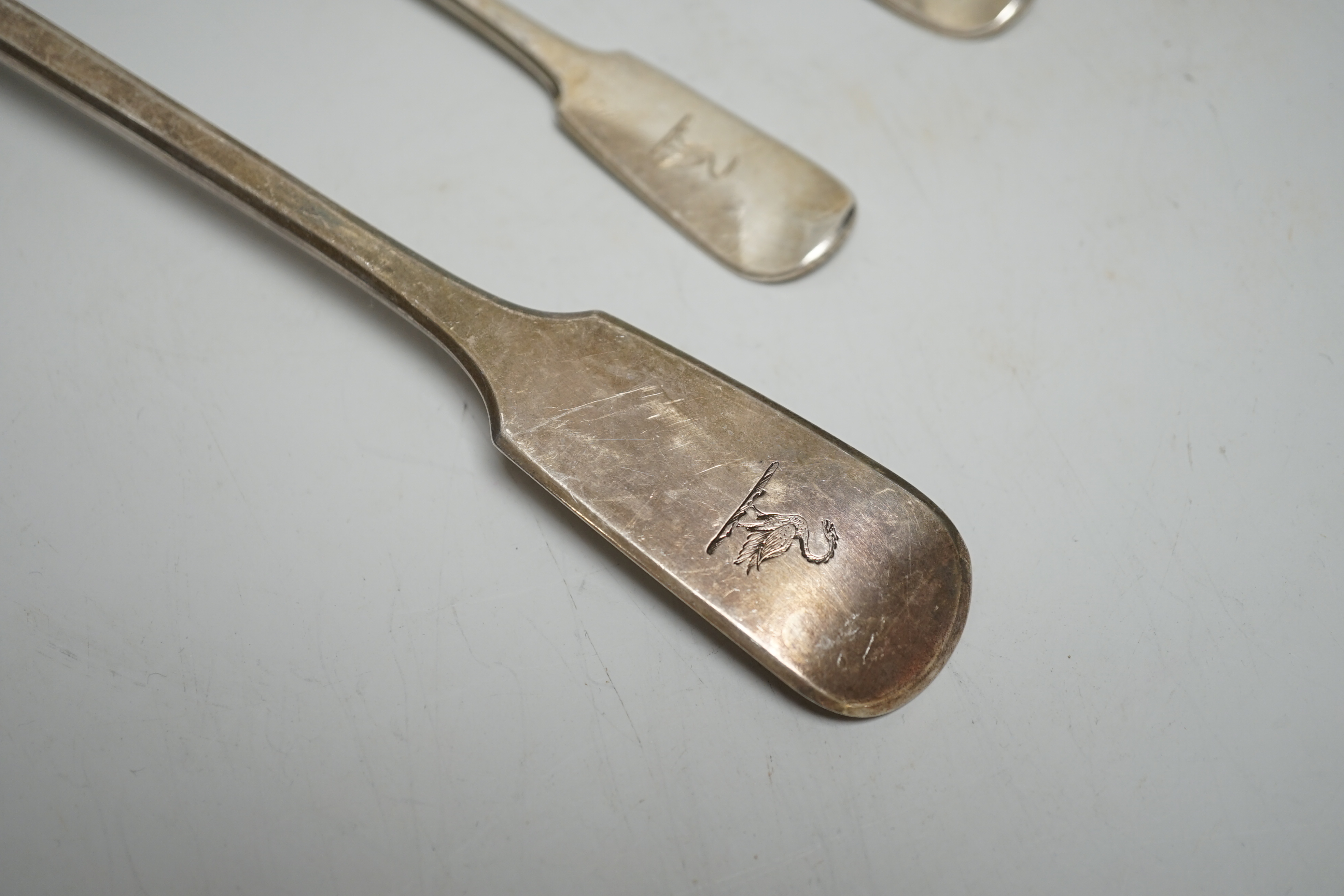 A Victorian silver fiddle pattern basting spoons, Charles Wallis, London, 1852, 30.4cm and a pair of Victorian provincial silver dessert forks, Josiah Williams & Co, Exeter, 1862, 7.6oz.